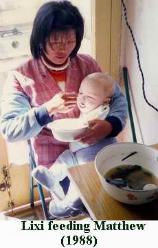 Lixi carrying Matthew in 1988.  The two were inseparable for the first few years!  Amoy Magic--Guide to Xiamen and Fujian.  Http://www.Amoymagic.com  Xiamen tourism, travel, study