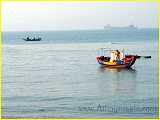 fishermen in their colorful minnan fishing boat in Xiamen bay