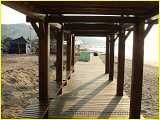 one of many delightful wooden pavilions' great place to rest sole and soul  fishermen like the boardwalk too--to dry their nets and fish traps!