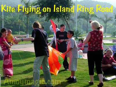 Sue and friends fly kites on the beach at the island ring road