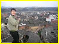 Babushka on a precarious perch taking photos of Tufang