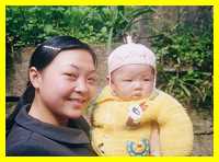 Proud young Hakka mother and child