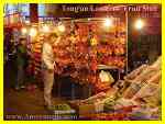 Selling lanterns and fruit at Lantern Festival in downtown Tong'an Xiamen at night