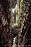 These are famous rocks that got caught in one of the narrow crevices Chinese like to call "A Thread of Sky!"